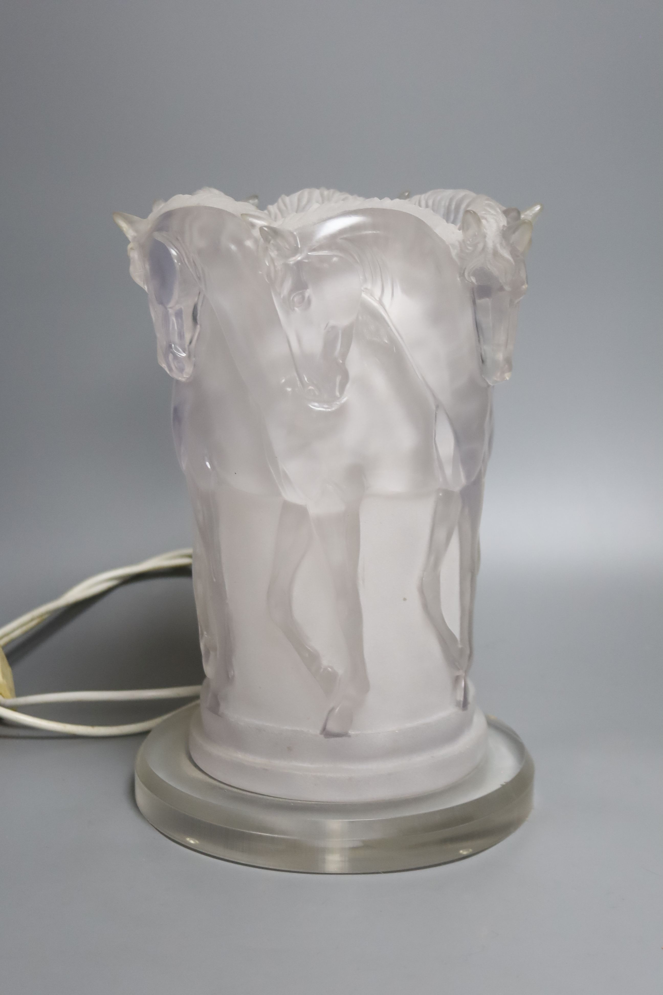 A bronze finish horse table lamp and simulated frosted glass horse lamp